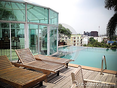 Swimming pool, terrace and outdoor chairs