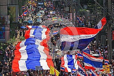 Thai protestors rally with large thai flag