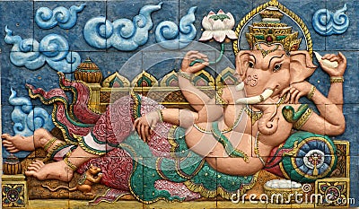 Thai style handcraft of ganesh hindu god on wall