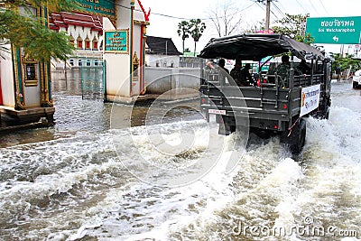 Thailand floods - People on Royal Thai Army truck