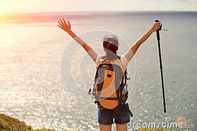 Thankful hiking woman seaside mountain