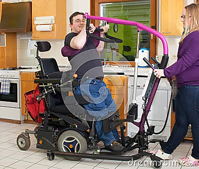 Therapist helping a young cerebral palsy patient.