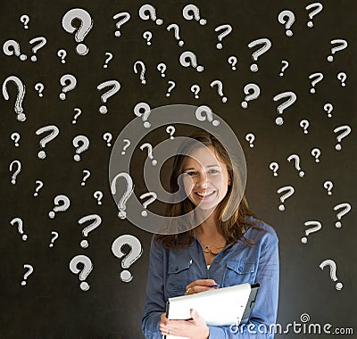 Thinking business woman with chalk question marks