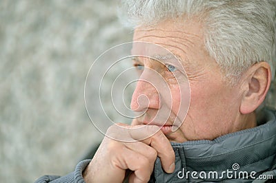 Thinking elderly man