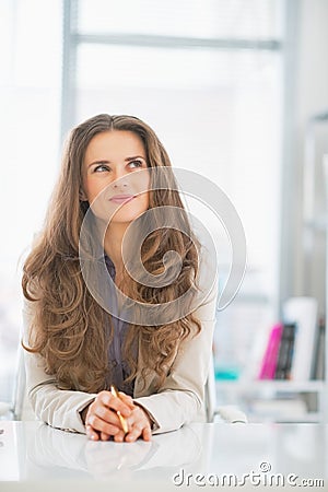 Thoughtful business woman looking on copy space