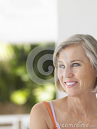 Thoughtful Happy Middle Aged Woman Looking Away