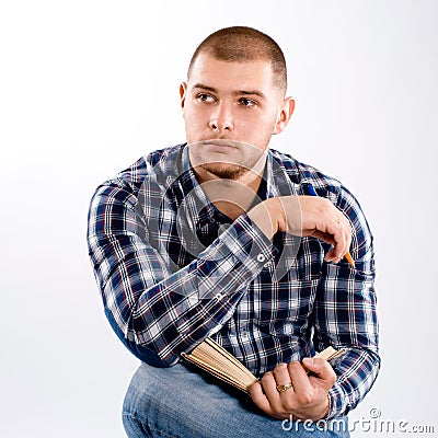 Thoughtful man wearing checkered shirt