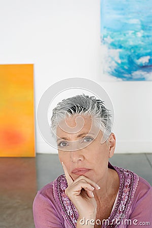 Thoughtful Senior Woman In Art Gallery