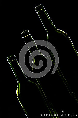 Three empty green bottles