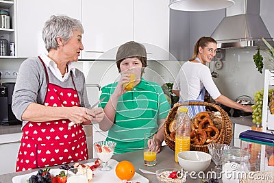 Three generations living together - happy family cooking togethe