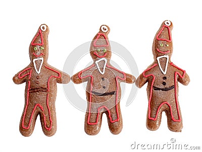 Three brown gingerbread santa clause figures with color icing shot on ... Three brown gingerbread santa clause figures with color icing shot on ...