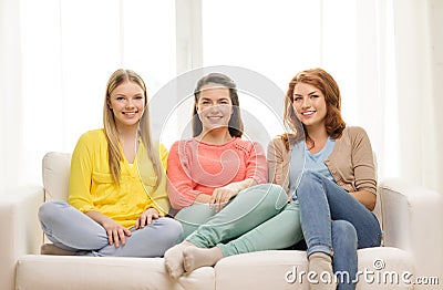 Three girlfriends having a talk at home