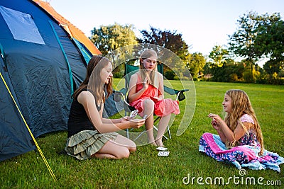 Three girls camping