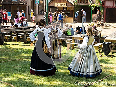 Three girls in medieval costumes