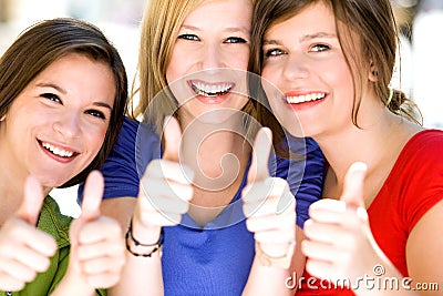 Three girls with thumbs up