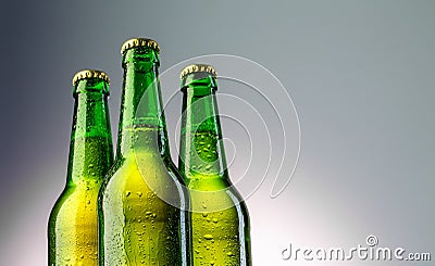 Three green beer bottles neck