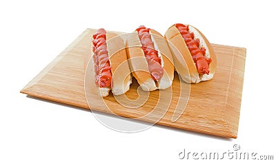 three-hot-dogs-board-isolated-over-white-7007492.jpg