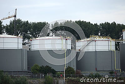 Three industrial storage tanks