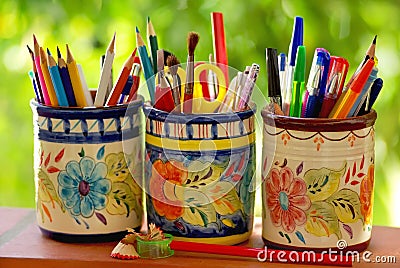 Three jars, pencils and school objects