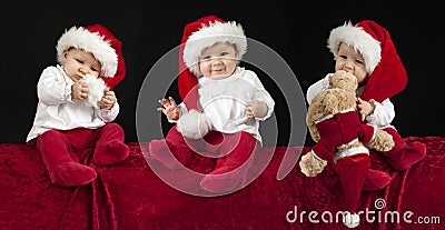 Three little babies with christmas hat