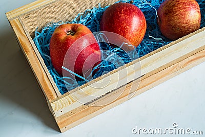 Three red apples delivered by mail