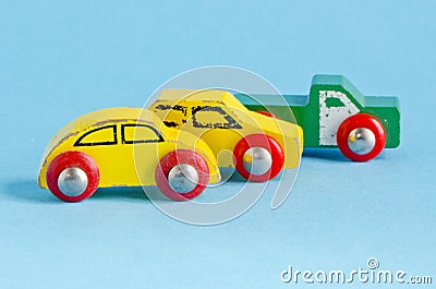 Three wooden cars toys on azure background