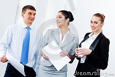 Three young business people laughing