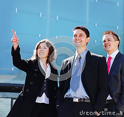 Three young business persons in formal clothes