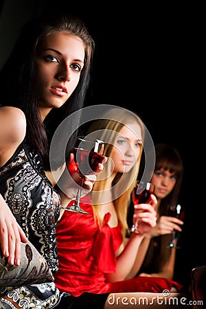 Three young women in a night bar