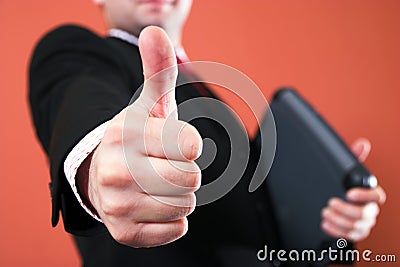 Successful Businessman Holding Thumb Up Ro