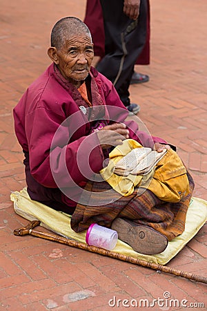 Tibetan monk reading a old tibetan manuscript