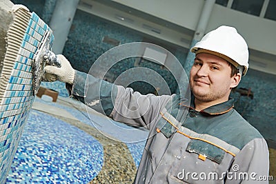 Tilers at industrial floor tiling renovation