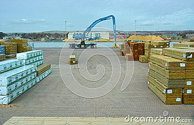 Timber yard dockside with grabber