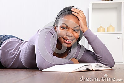 Time out student girl looks up from reading book
