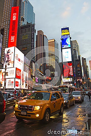 Times Square with animated LED signs and yellow cabs, Manhattan, New York City.