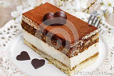 Tiramisu cake on white plate