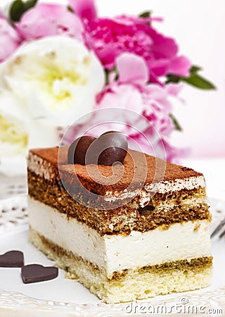 Tiramisu cake on white plate