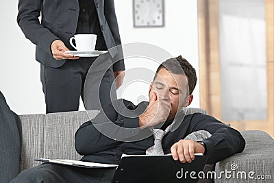 Tired businessman at office