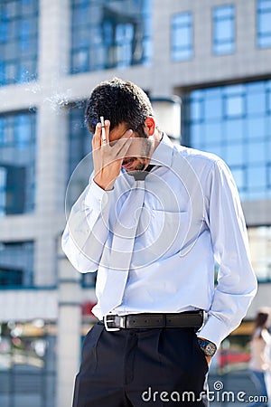 Tired businessman smoking