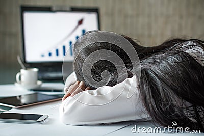 Tired businesswoman sleeping in office