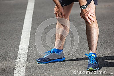 Tired male runner resting.