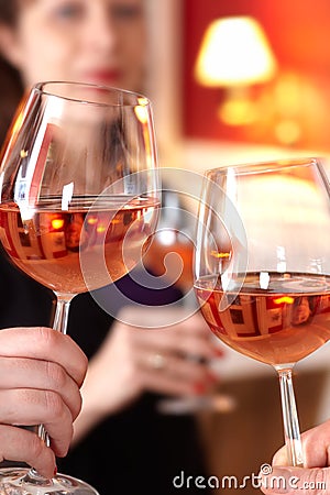 Toast in restaurant with full glasses of wine