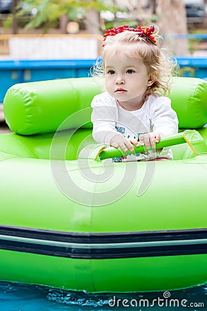 Toddler girl in the amusement park