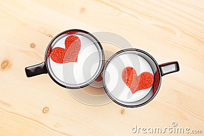 Top of view of cups of milk with decorative heart on wood table, concept of valentine day