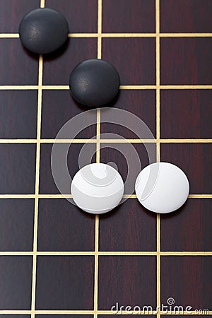 Top view of few stones during go game playing