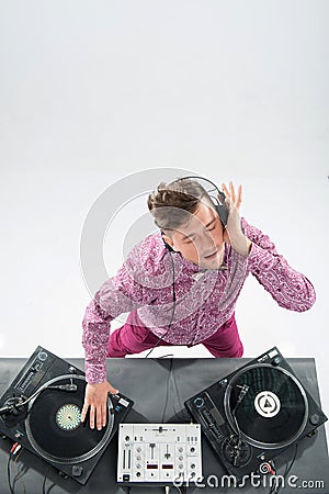 Top view portrait of dj mixing and spinning