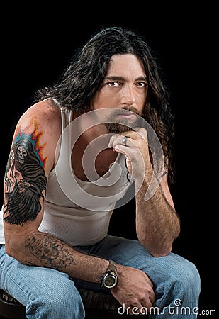 Tough Sexy man with long dark hair and beautiful brown eyes