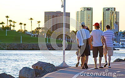 Tourist men walking at the beach