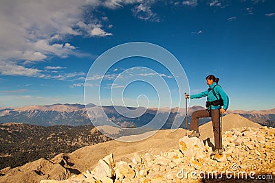 Tourist woman on the top of mount,