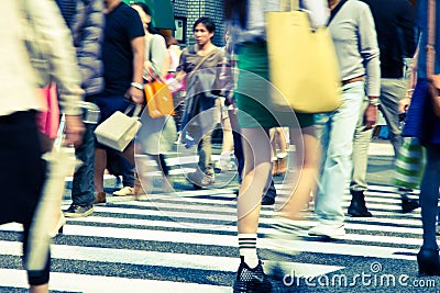 Tourists and business people crossing the street a